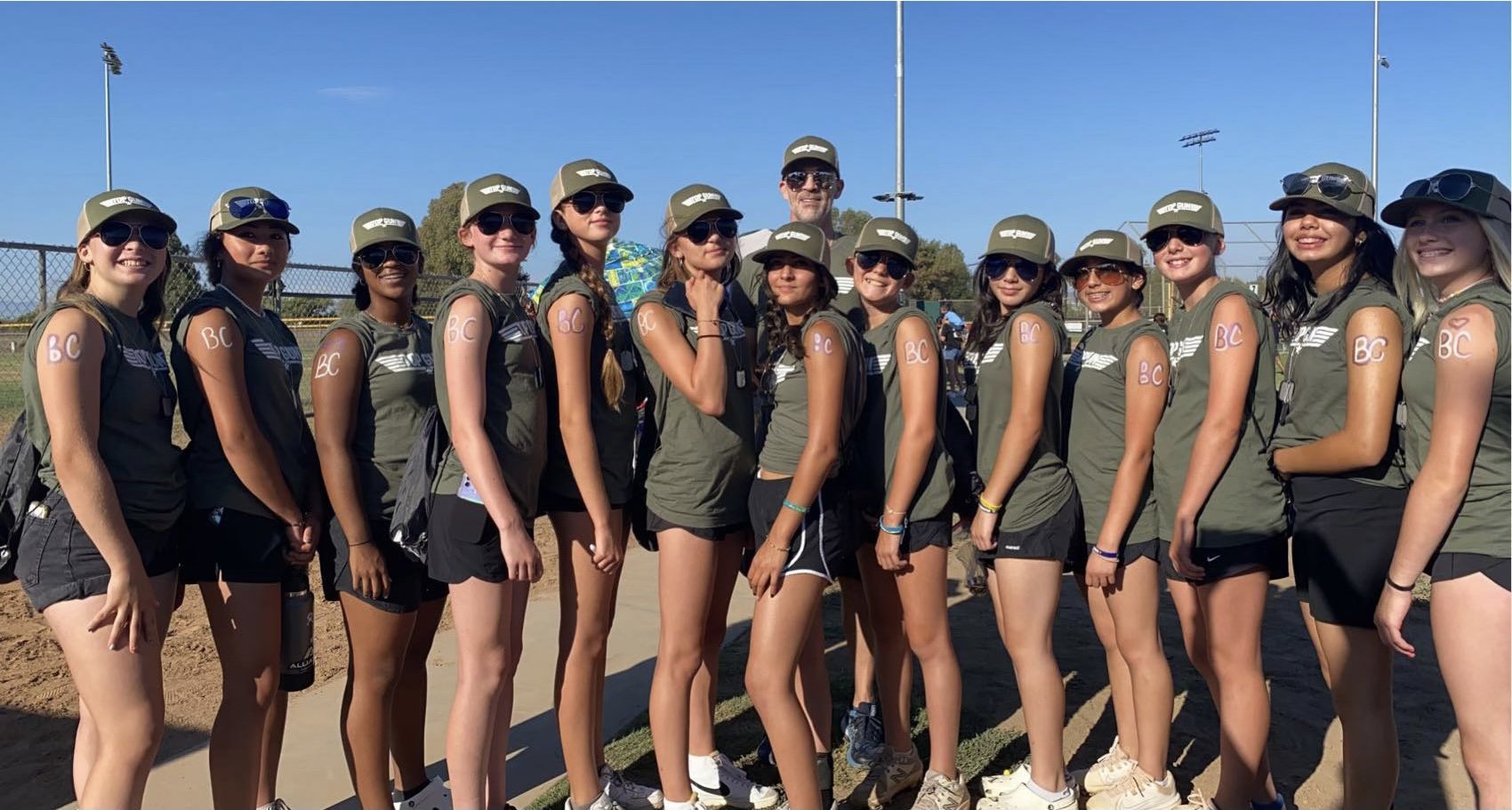 The El Segundo Eagles lined up shoulder to shoulder, every player with BC written on her arm, Steve Cleland standing behind them